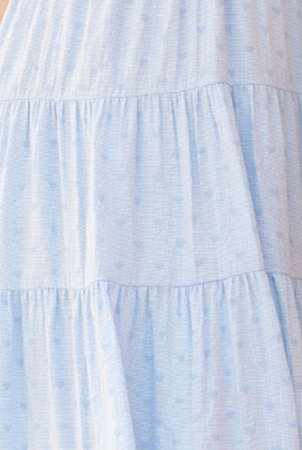 Light blue dress on a beige background