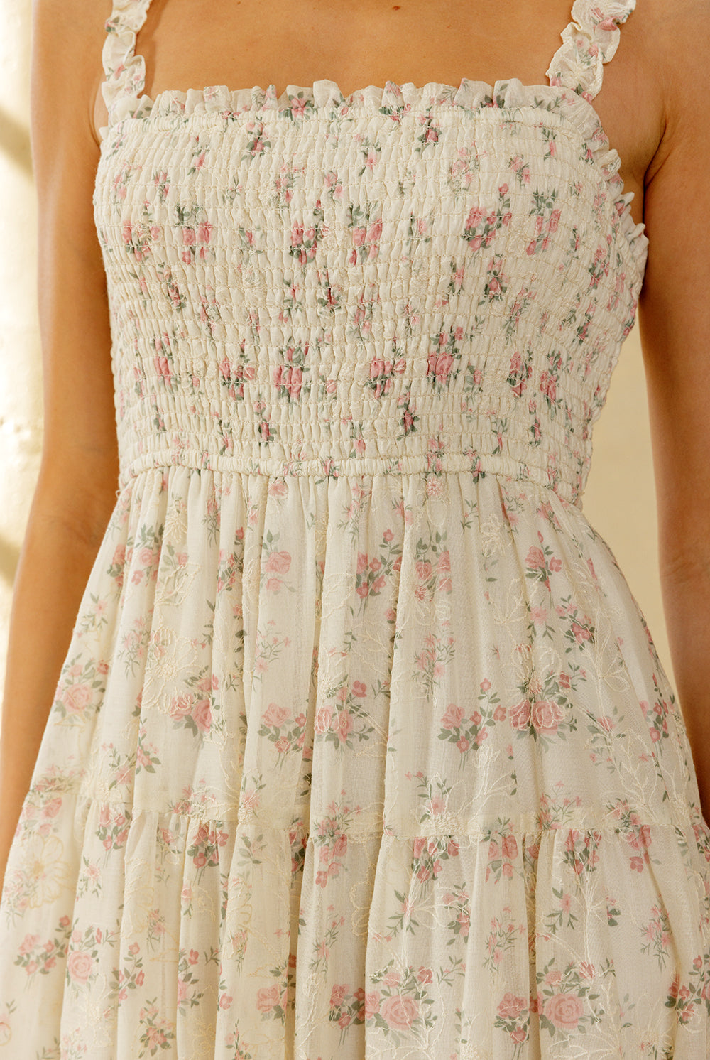 Floral dress with thin straps on a blurred background