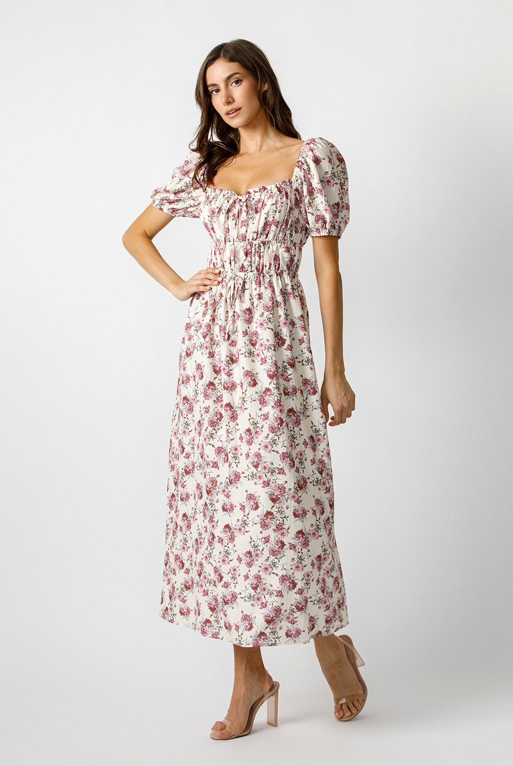 Woman wearing a floral dress on a white background