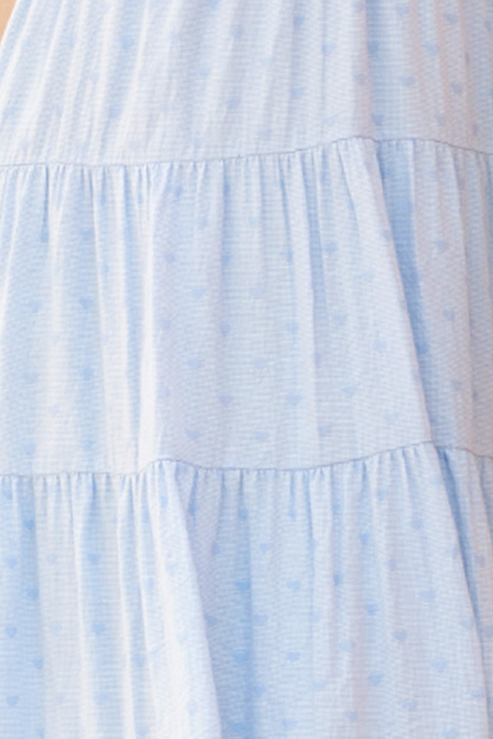 Light blue dress on a beige background