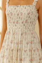 Floral dress with thin straps on a blurred background