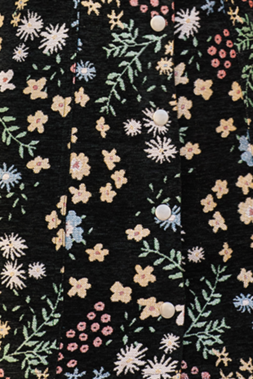 Close-up black dress with floral pattern