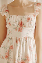 Floral dress with a soft beige background