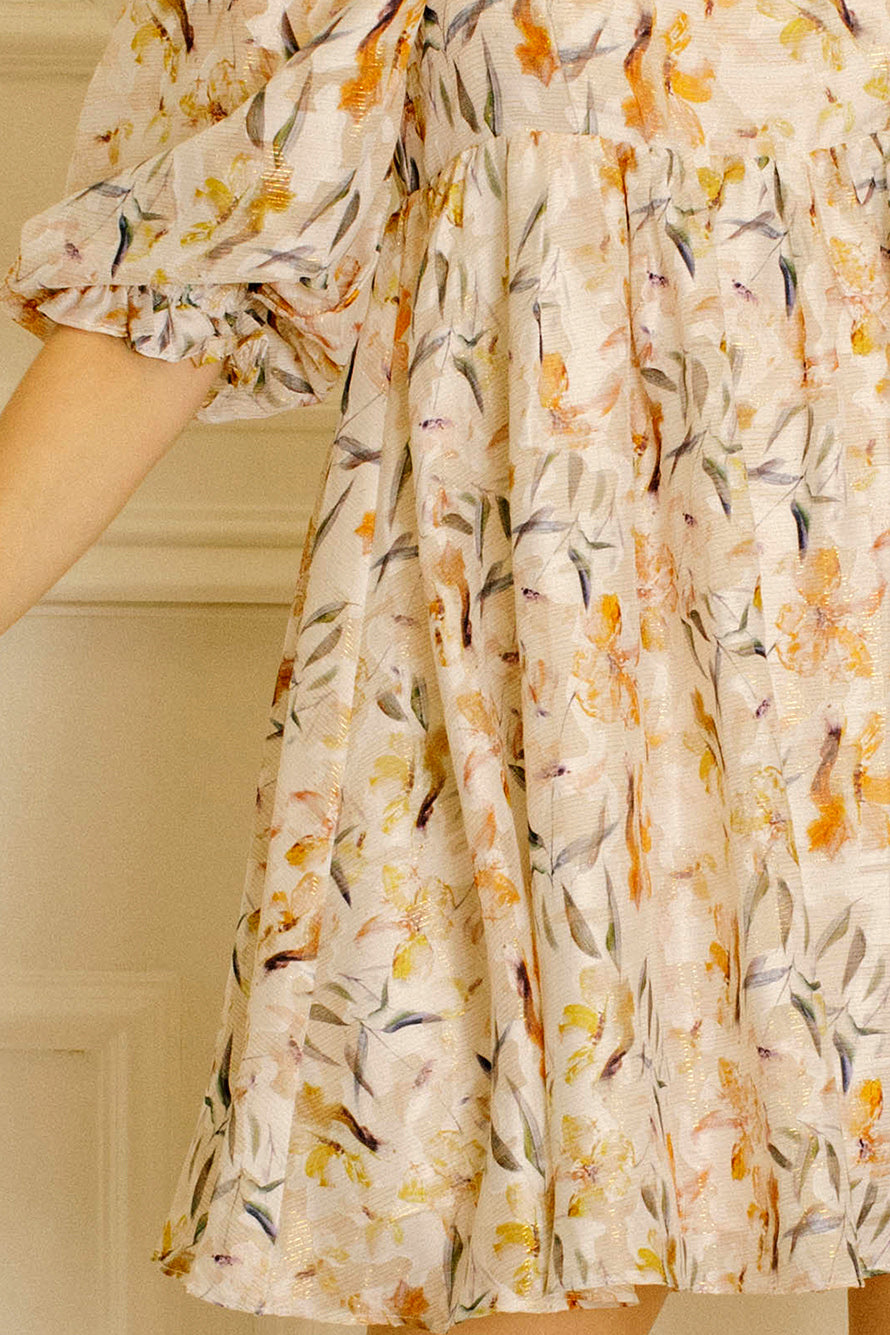 Close-up of a floral dress with a neutral background