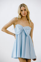The Flirt Bow Mini Dress Small Front in Blue