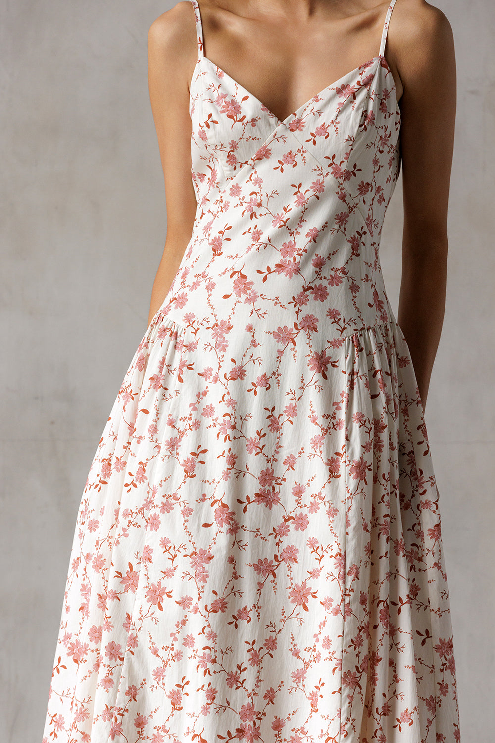 Floral dress with mauve flowers on a plain background