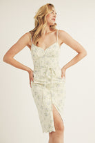 Woman wearing a floral dress with a white background