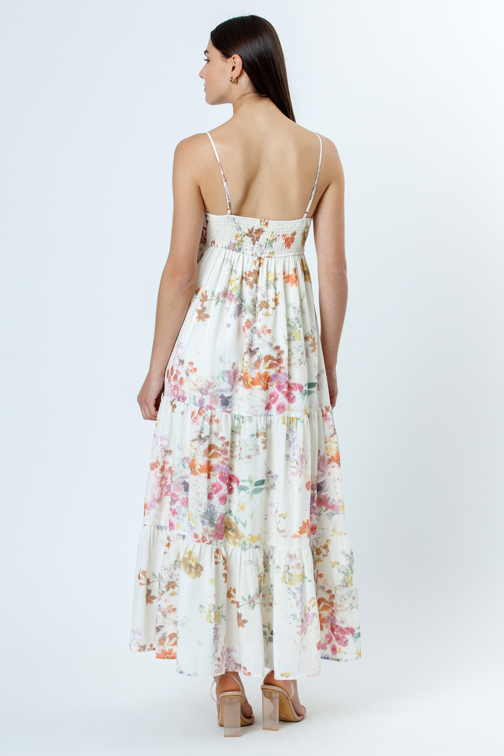 Back view of a floral dress on a white background