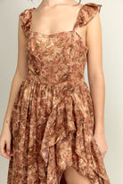 Close-up view of a brown floral dress with a neutral background
